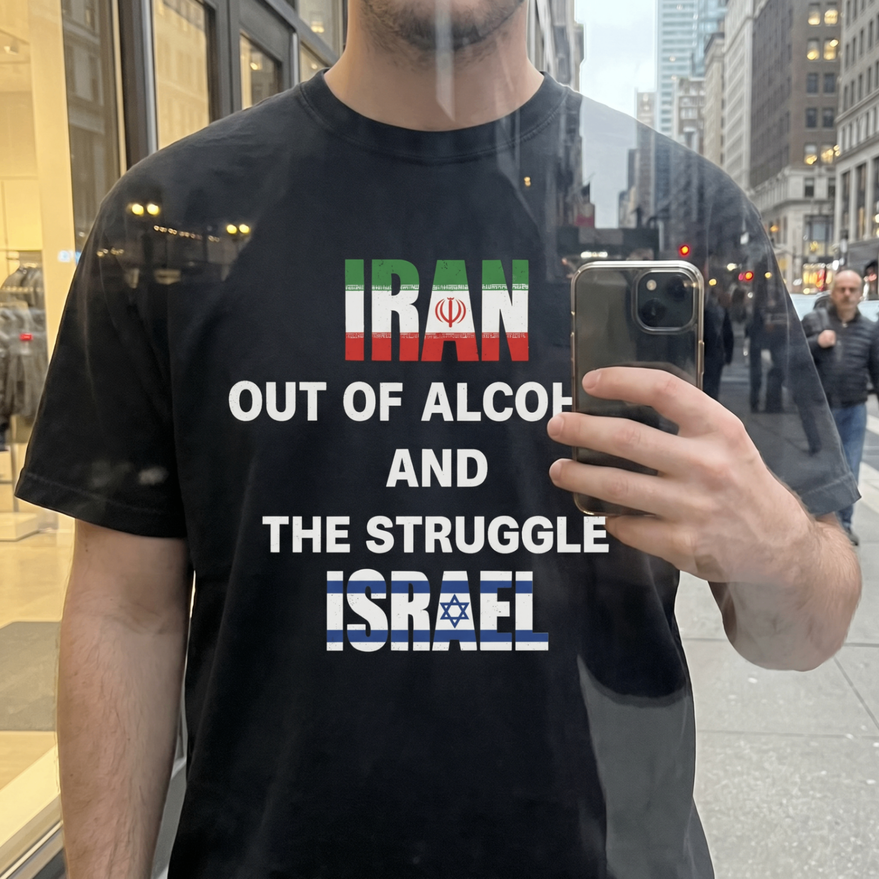 Customer wearing a bold political slogan tee from The Funny Shirt Store on a city street.